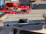 a tool box sitting on a table with other tools