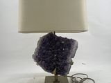 purple amethorate lamp with a white shade on a metal base