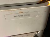 a white printer sitting on top of a white counter