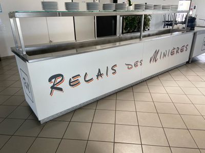 a picture of a restaurant kitchen with a large counter