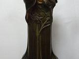 two vases that are sitting on a wooden table