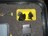 an image of a case with a yellow box and wires in it