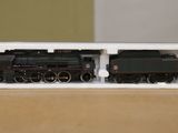a toy train sitting in a white box on a table