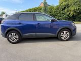 the blue suv is parked in the parking lot