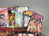 a lot of comic books that are on the table