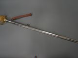 a sword that is on display on a table
