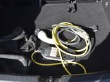 a hose in the trunk of a car with a hose attached to it