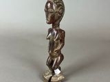 an old bronze figurine of a boy on a skateboard