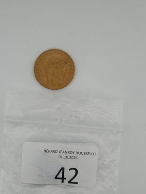 a close up of a coin in a plastic bag on a table