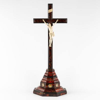 a wooden cross with a crucif on top of it