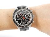 a wrist with a watch on it that is on a person ' s arm