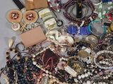 a pile of assorted jewelry on a table