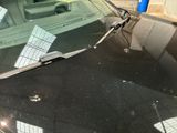 a car that has a broken windshield and a broken windscreen