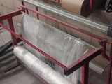a machine that has a roll of paper on it