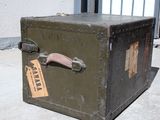 an old suitcase sitting on the ground outside
