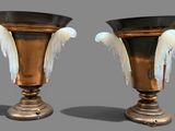 two vases that are sitting next to each other