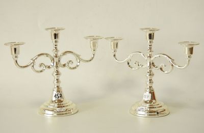 pair of silver plated candelabs with ornate designs