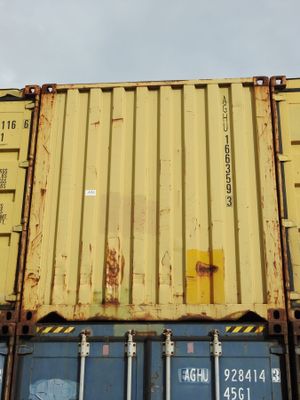 a yellow container sitting on top of a blue container