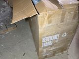 a cardboard box that is sitting in the middle of a room