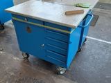 two blue carts that are sitting in a room
