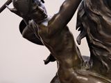 bronze statue of a man on a horse holding a sword