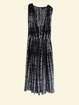 a black and white tie dye dress hanging on a hanger