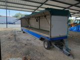a trailer that is sitting in the dirt