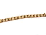 a close up of a gold bracelet on a white background