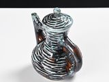 a glass vase that is sitting on a table