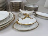 a lot of plates and bowls on the table