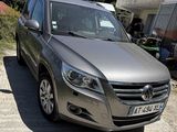 a picture of a silver car parked in a lot