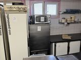 an image of a kitchen with a lot of food on the counter