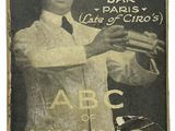 un vieux livre sur lequel figure la photo d'un homme en train de préparer des cocktails