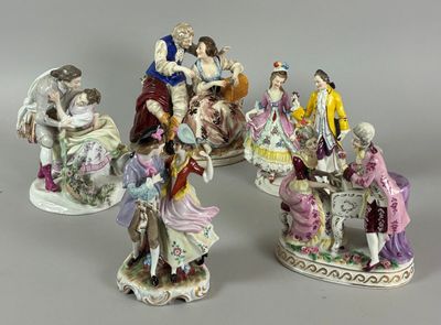five figurines of people sitting on a bench