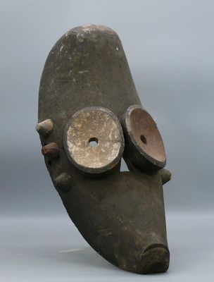 an image of a sculpture of a mask with two eyes