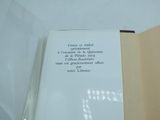 an open book with writing on it sitting on a table