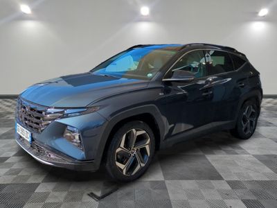 a blue 2021 toyota rav parked in a room with checkered floor