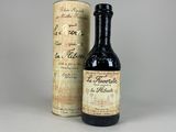 a bottle of wine sitting next to a bottle of wine