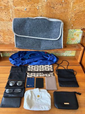 many items that are sitting on a wooden bench