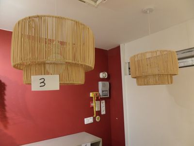 two lamps hanging from the ceiling in a room