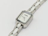 an image of a close up of a wrist watch on a white surface