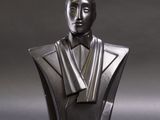 sculpture of a bust of a man in a tuxedo with a bow tie