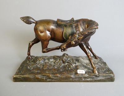 bronze statue of a horse with a saddle on it ' s back