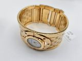 an image of a gold bracelet with a watch on it