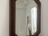 a mirror that is sitting on top of a table