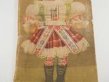 an old cardboard box with a doll in it and a sign on it