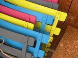 a lot of chairs that are stacked on top of each other