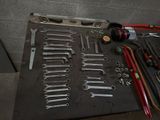a lot of tools that are laying out on the table