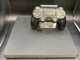 a video game controller sitting on top of a metal box