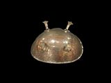 an image of a silver helmet on a black background